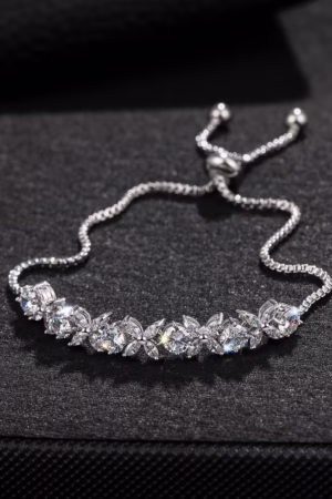 A dazzling silver bracelet with cubic zirconia stones on a black background.