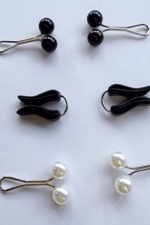 Set of 6 faux pearl hijab pins with mixed simple designs, perfect for securing headscarves and adding a touch of elegance to Muslim outfits.
