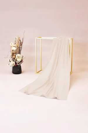 Lightweight beige chiffon hijab with a soft and flowy texture, ideal for versatile styling.