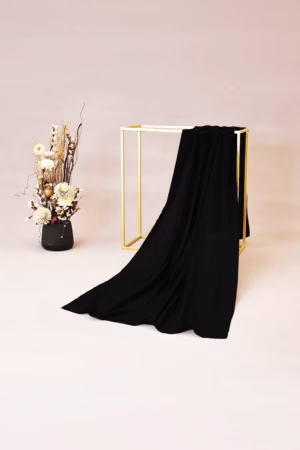 Lightweight black chiffon hijab with a soft and elegant drape, ideal for versatile styling.