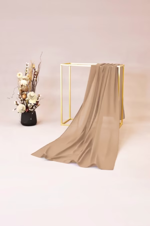 Lightweight camel chiffon hijab with a smooth and flowy texture, ideal for versatile and chic styling.