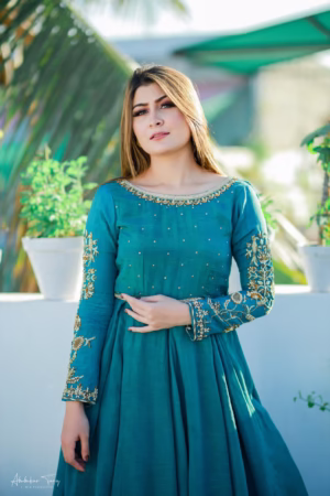 Solid green hand-embroidered Anarkali dress with intricate detailing, paired with a matching dupatta, perfect for weddings and formal events.