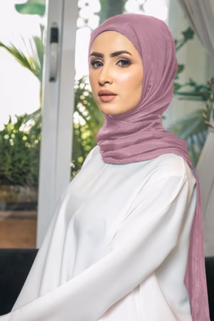 Elegant mauve silk hijab with a soft and luxurious finish, ideal for casual and formal wear.