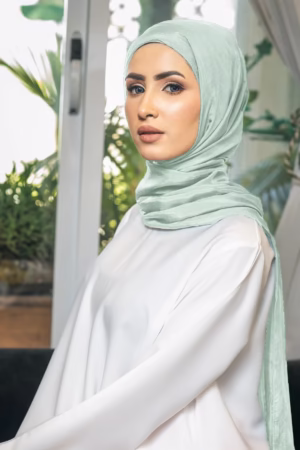Luxurious mint silk hijab with a soft, lightweight feel and a fresh, elegant color for versatile styling.