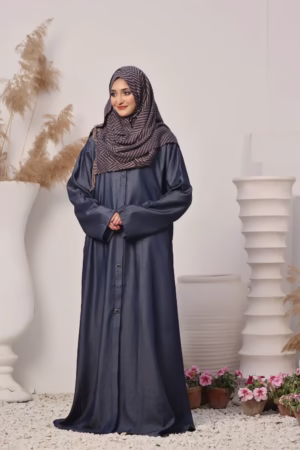 A Denim Blue Abaya displayed on a mannequin, showcasing its elegant design and soft, breathable fabric.
