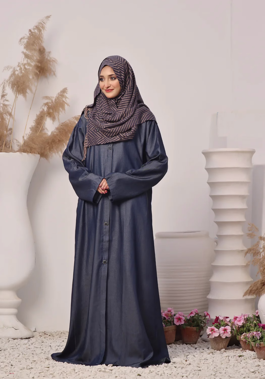 Denim Blue Abaya: Elegant, Comfortable, and Timeless A Denim Blue Abaya displayed on a mannequin, showcasing its elegant design and soft, breathable fabric.