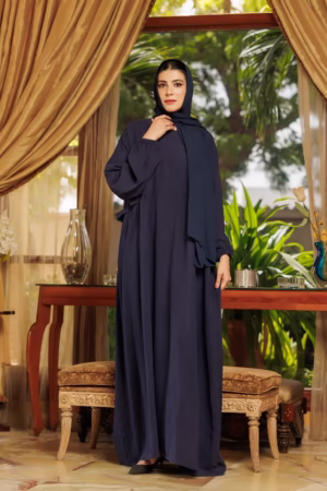 A Loop Button Blue Abaya displayed on a mannequin, showcasing its delicate button details and flowing, soft fabric.