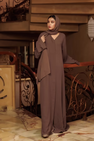 A Brown Cafifa Style Abaya draped elegantly on a mannequin, highlighting its flowing silhouette and rich color.