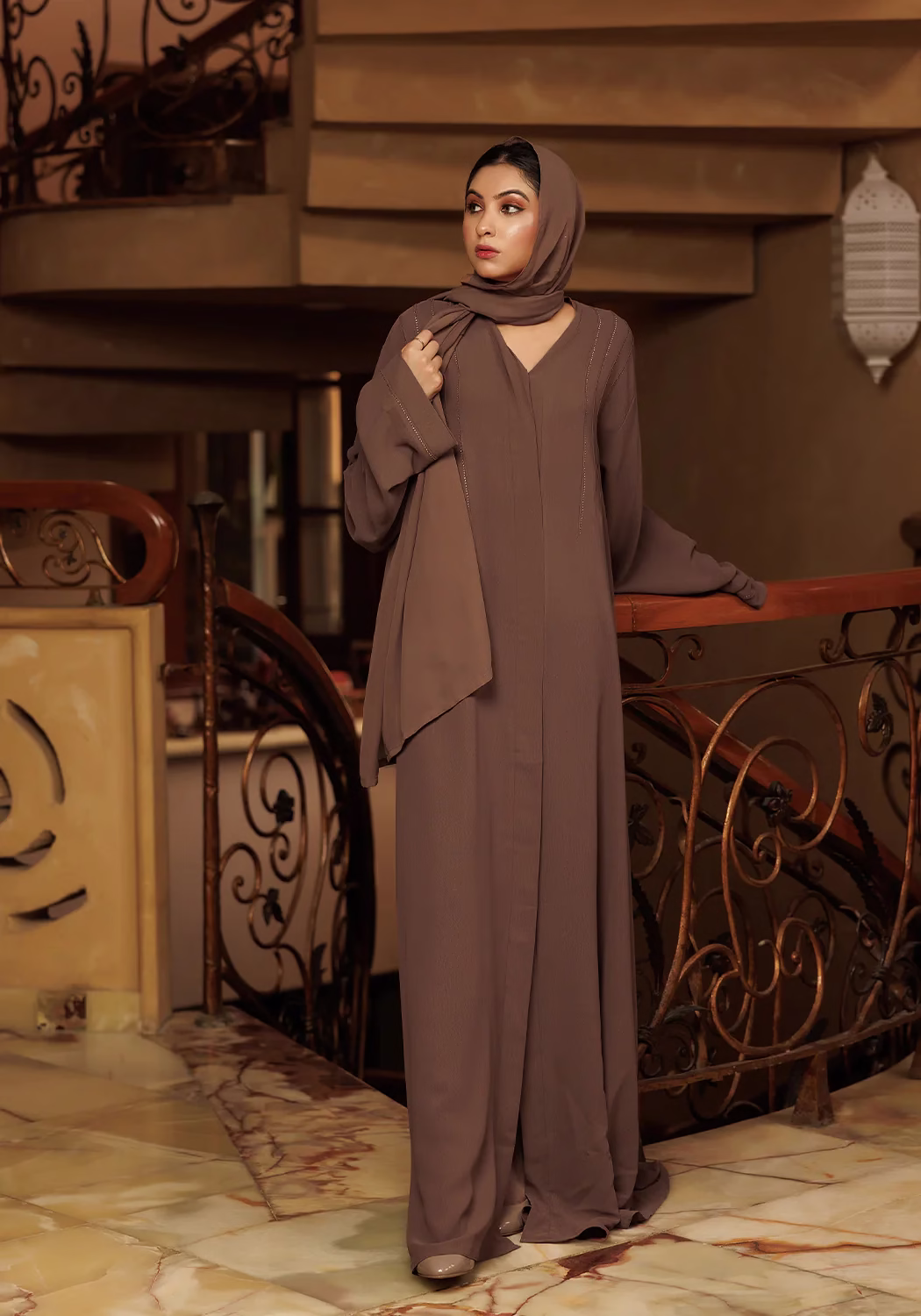 Brown Cafifa Style Abaya: Sophisticated, Comfortable, and Elegant A Brown Cafifa Style Abaya draped elegantly on a mannequin, highlighting its flowing silhouette and rich color.
