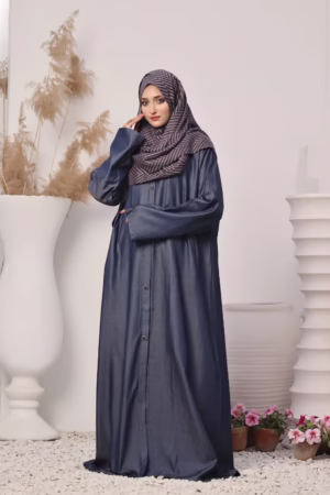 A Denim Blue Abaya displayed on a mannequin, showcasing its elegant design and soft, breathable fabric.