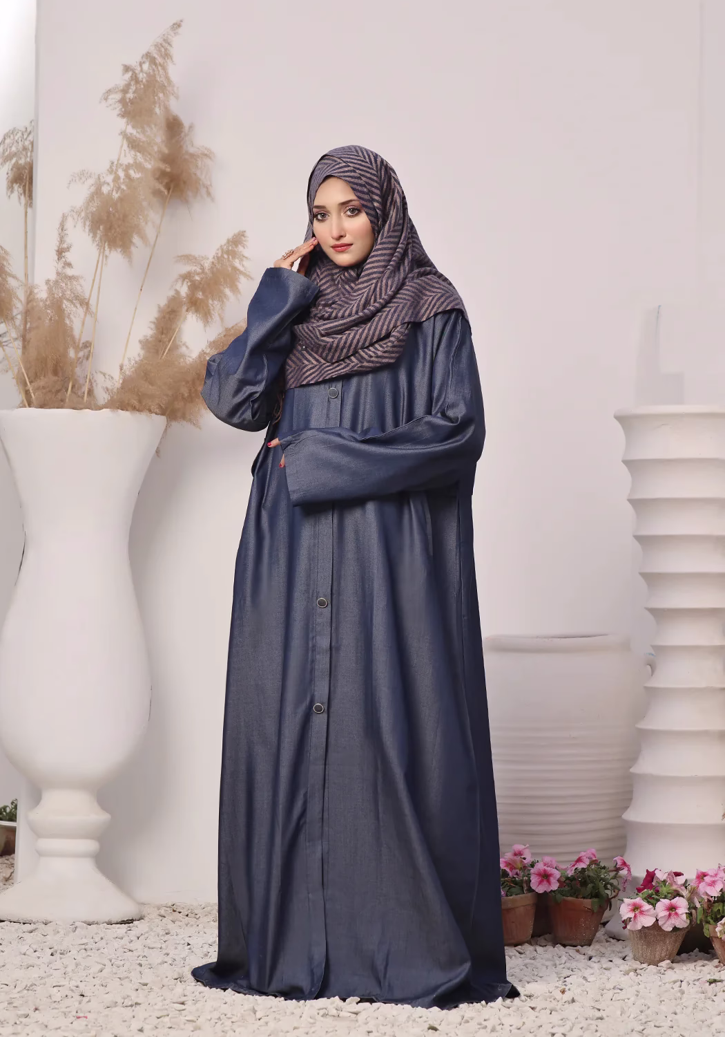 Denim Blue Abaya: Elegant, Comfortable, and Timeless A Denim Blue Abaya displayed on a mannequin, showcasing its elegant design and soft, breathable fabric.