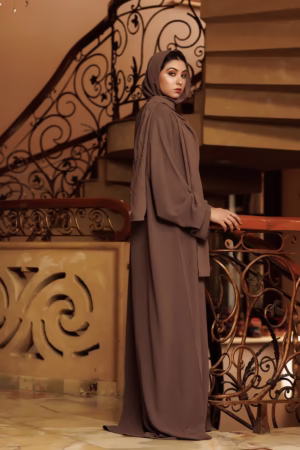 A Brown Cafifa Style Abaya draped elegantly on a mannequin, highlighting its flowing silhouette and rich color.