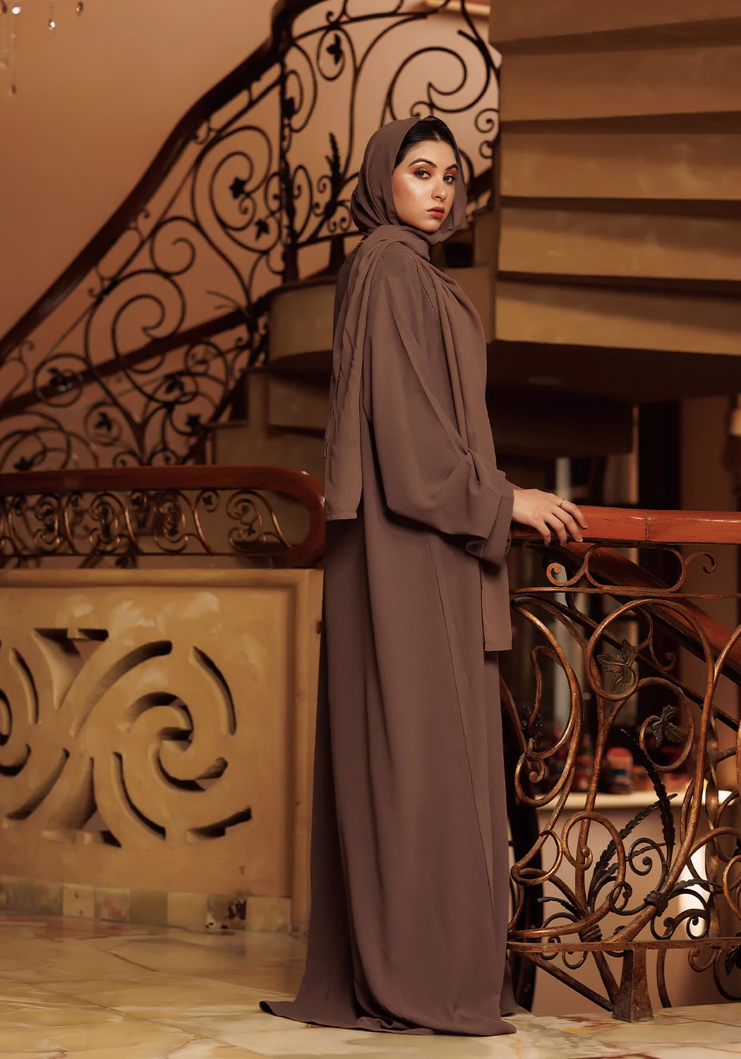 Brown Cafifa Style Abaya: Sophisticated, Comfortable, and Elegant A Brown Cafifa Style Abaya draped elegantly on a mannequin, highlighting its flowing silhouette and rich color.