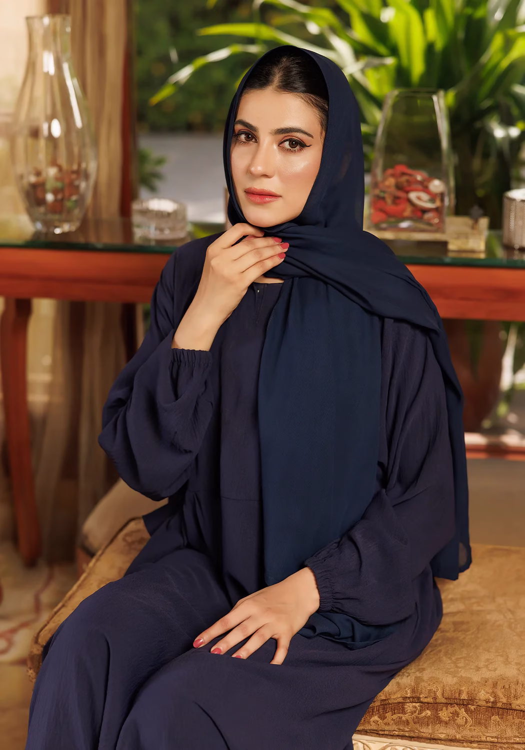 Loop Button Blue Abaya: Stylish Modesty with Unique Button Detailing A Loop Button Blue Abaya displayed on a mannequin, showcasing its delicate button details and flowing, soft fabric.